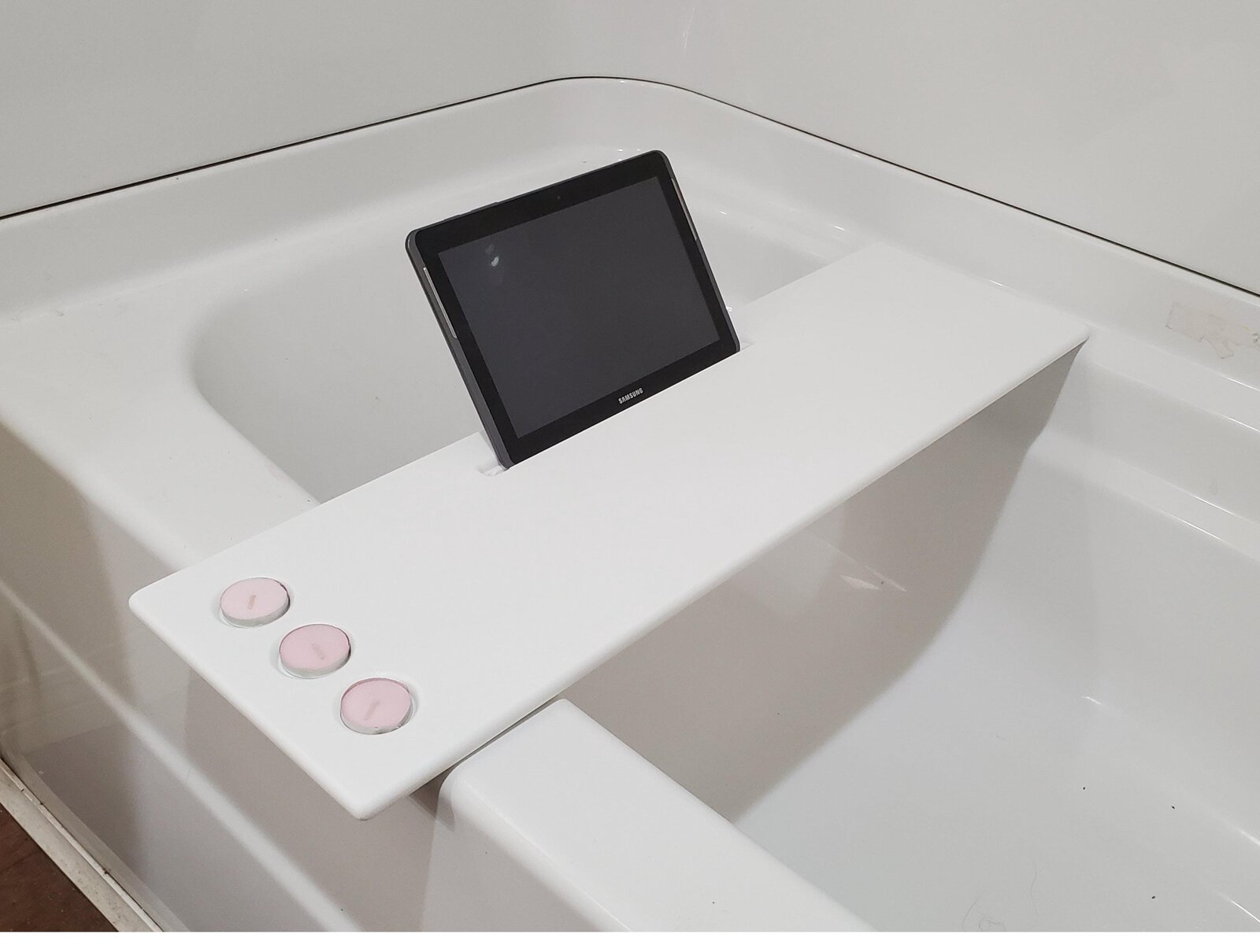 Corian bathtub tray with tablet stand, made to order by Crafted Carvings